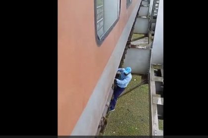 Locomotive pilot risks life to fix air leakage under train on railway bridge | Watch