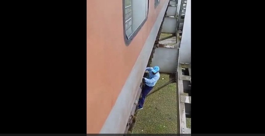 Locomotive pilot risks life to fix air leakage under train on railway bridge | Watch