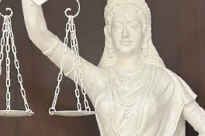 Blindfold replaced with open eyes, sword by Constitution in new Justice statue in SC