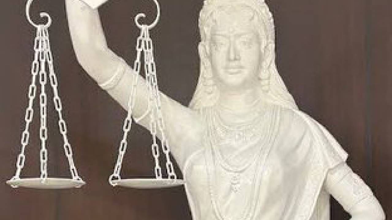 Blindfold replaced with open eyes, sword by Constitution in new Justice statue in SC