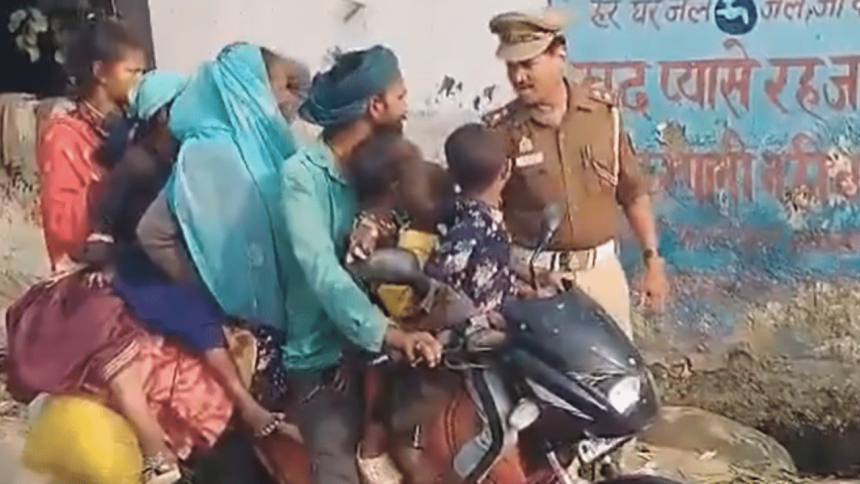 Bizarre scene in UP: Family of eight with mattresses on one bike caught on camera