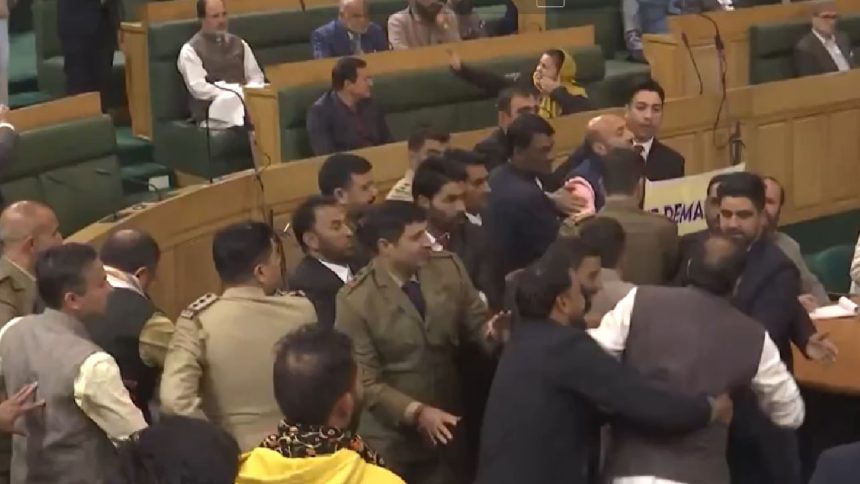 WATCH: Scuffle in Jammu and Kashmir Assembly over ‘restore Article 370’ poster 1 WATCH: Scuffle in Jammu and Kashmir Assembly over ‘restore Article 370’ poster