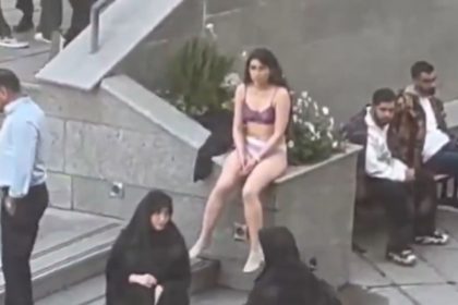 Iran woman strips at university to protest against strict Islamic dress code | Video