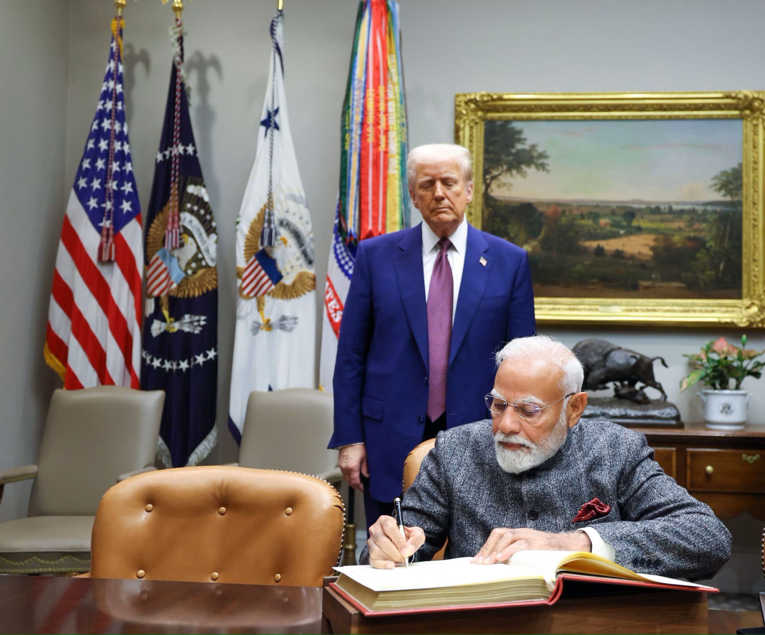 Glimpse of PM Modi in pictures from February 7 PM Modi signs the White House visitors book as President Trump looks on scaled