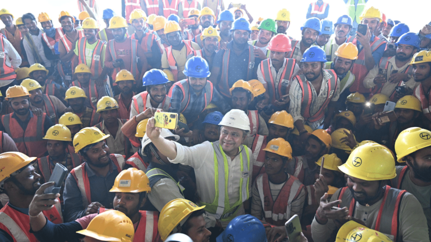 Ashwini Vaishnaw joins bullet train workers on ground, clicks selfies with them