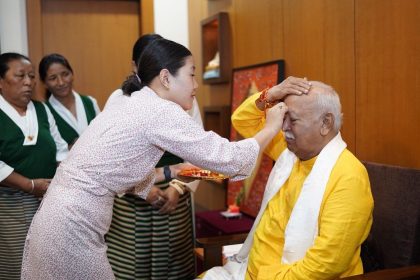 Female members of Regional Tibetan Women’s Association, Bharat Tibet Cooperation Forum tie rakhi to RSS chief